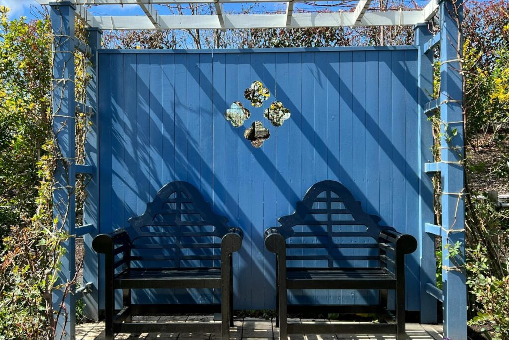 image of a blue painted pergola