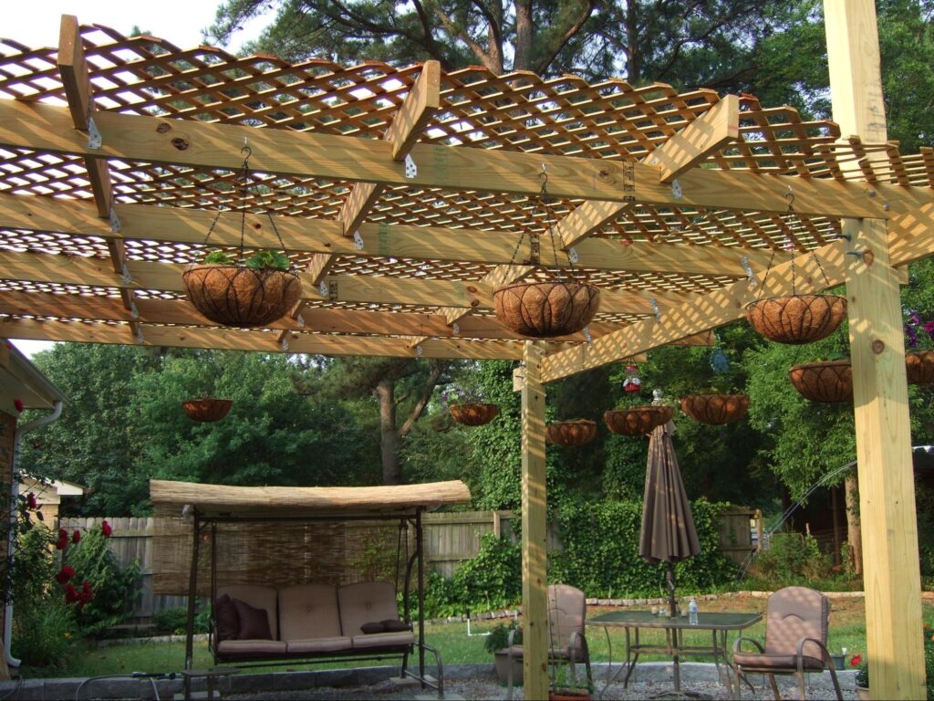 image of a pergola with plant hangers