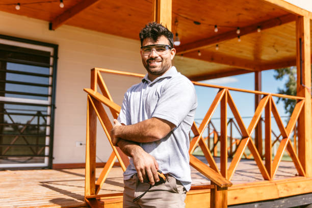 Man working outdoors on wooden porch